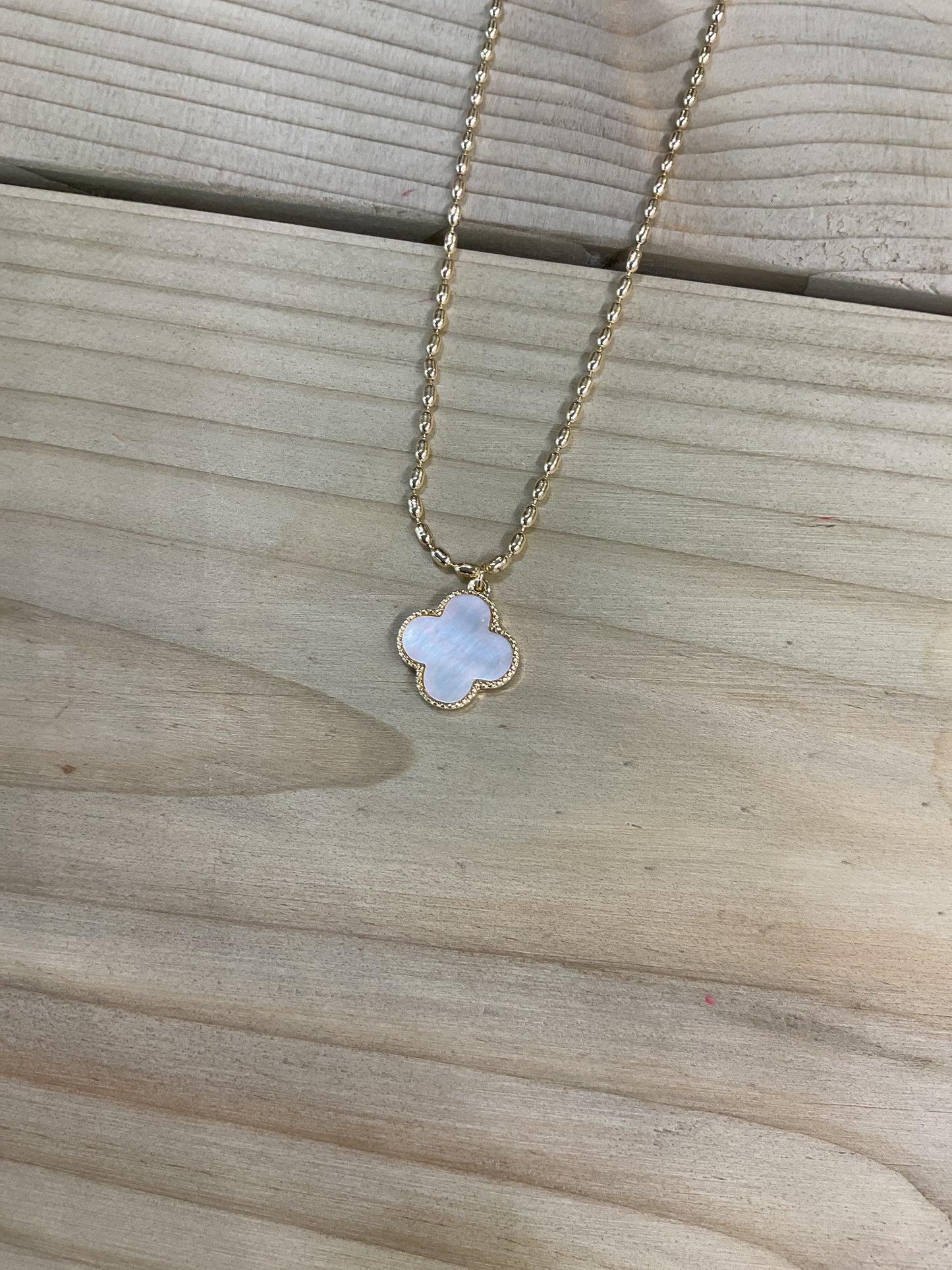Four leaf iridescent gold necklace