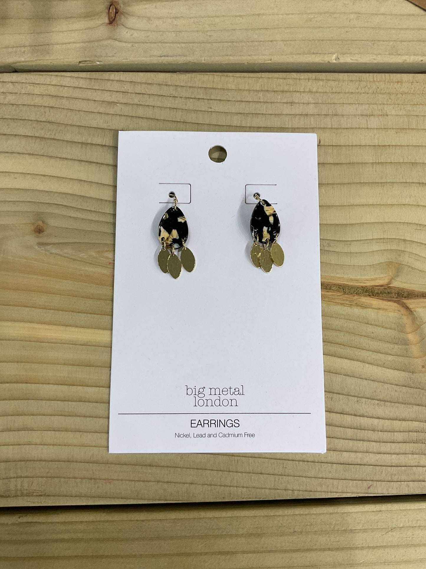 Black and gold resin earrings