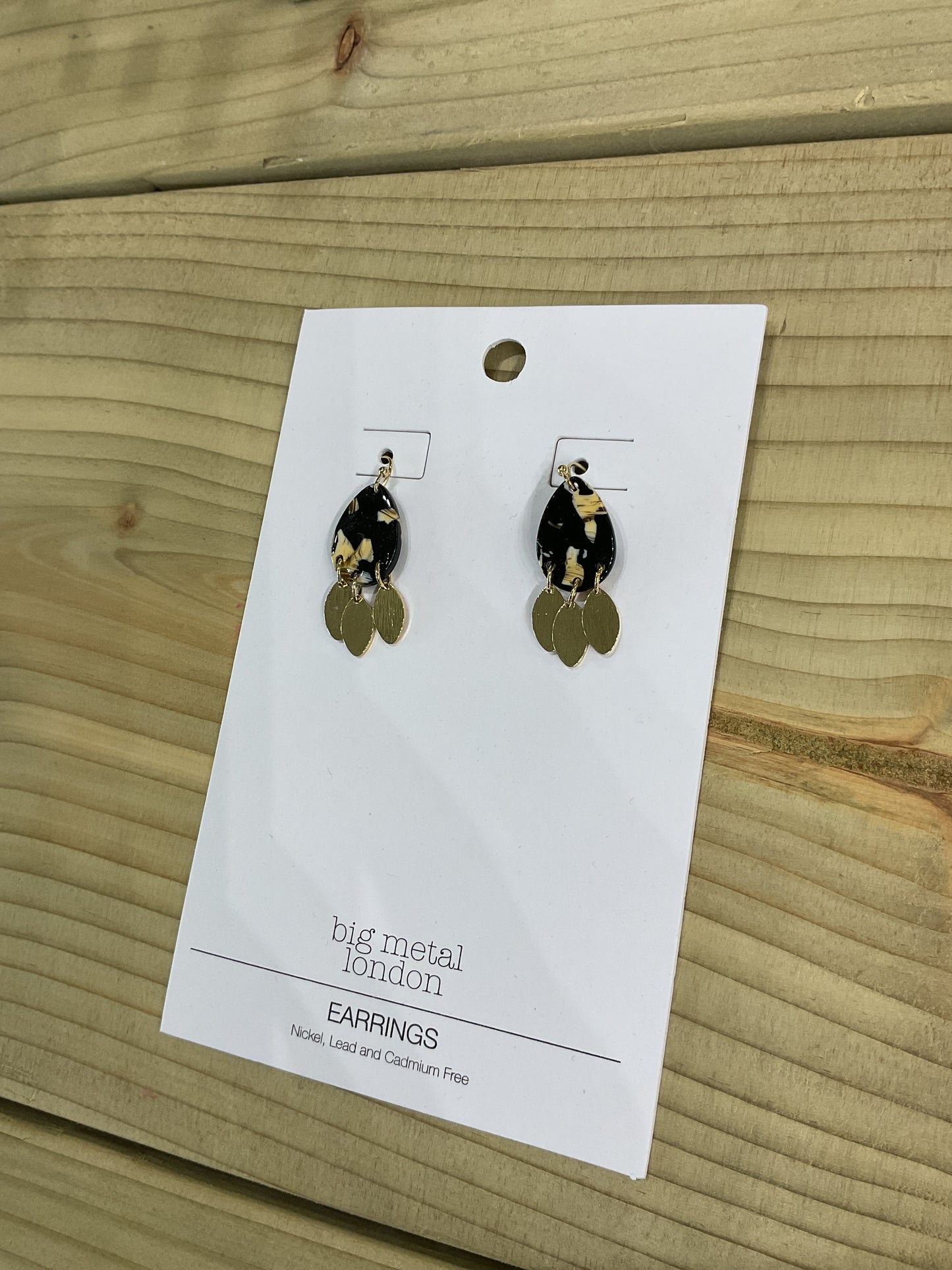 Black and gold resin earrings