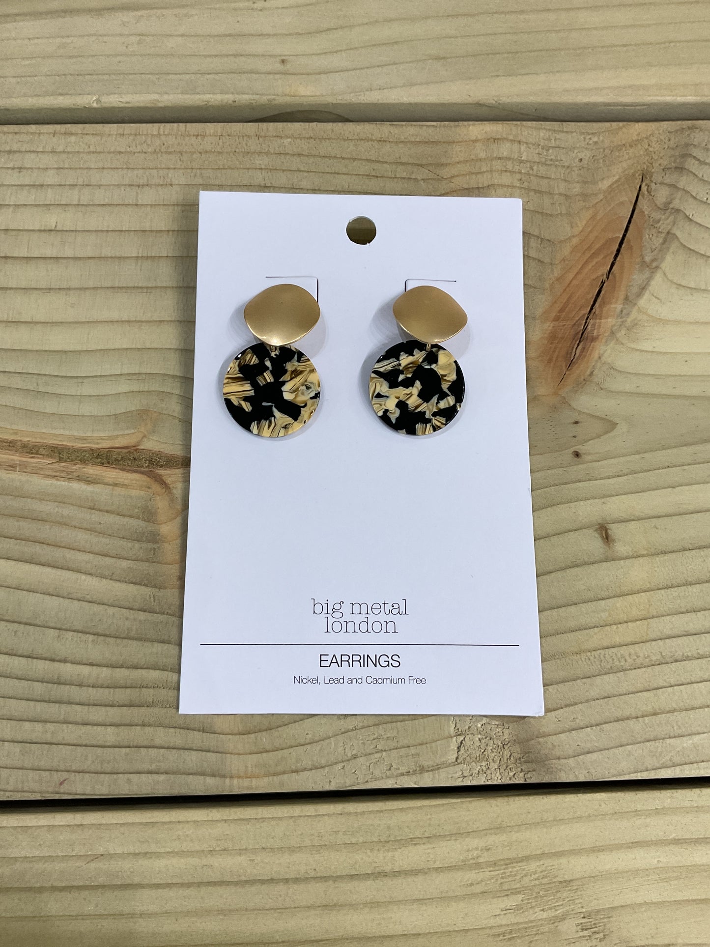 Black and gold resin earrings